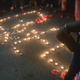 Friends and family attend a candlelight vigil in memory of Bee Love Slater.